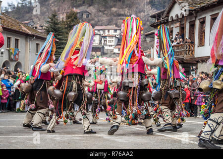 SHIROKA LAKA, BULGARIA - MARCH 01, 2015 - Kukeri mask festival and masquerade games 01 March 2015. Bulgarian traditional dances and costumes called Ku Stock Photo