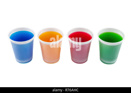 Plastic cups filled in with different collored water. Stock Photo