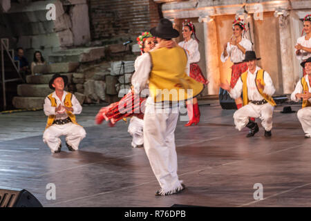 PLOVDIV, BULGARIA - AUGUST 06, 2015 - 21-st international folklore festival in Plovdiv, Bulgaria. The folklore group from Serbia dressed in traditiona Stock Photo