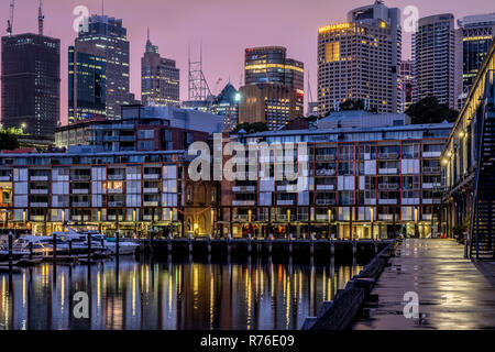Luxury apartments on Sydney Harbour our at dawn - Sydney City in the background Luxury apartments on Sydney Harbour our at dawn - Sydney City in the background