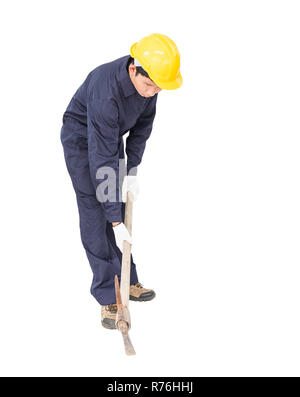 Man in uniform hold old pick mattock that is a mining device Stock Photo