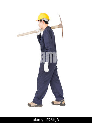 Man in uniform hold old pick mattock that is a mining device Stock Photo