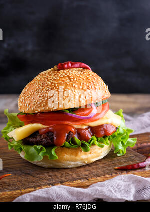 fresh homemade burger with lettuce, cheese, onion and tomato Stock Photo