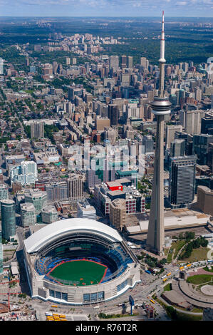 A vertical aerial view of downtown Toronto featuring the CN Tower and sports stadium. Stock Photo
