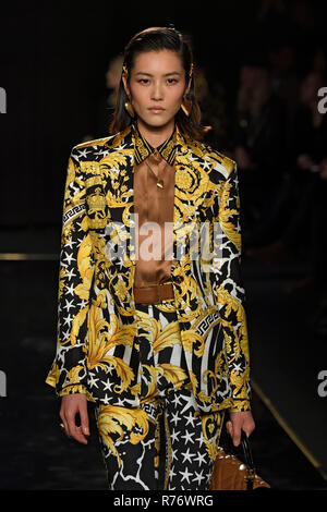 NEW YORK, NY - DECEMBER 02: Model Liu Wen walks the runway at the Versace Pre-Fall 2019 Collection at The American Stock Exchange on December 02, 2018 Stock Photo