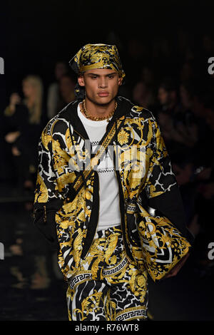 NEW YORK, NY - DECEMBER 02: Model walks the runway at the Versace Pre-Fall 2019 Collection at The American Stock Exchange on December 02, 2018 in New  Stock Photo