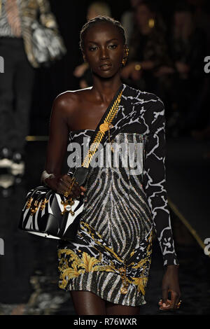 Model Anok Yai walks on the runway during the Saint Laurent Ready to ...