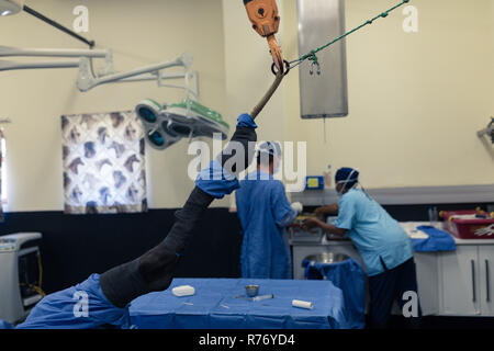Surgeon and nurse working in operation theatre Stock Photo