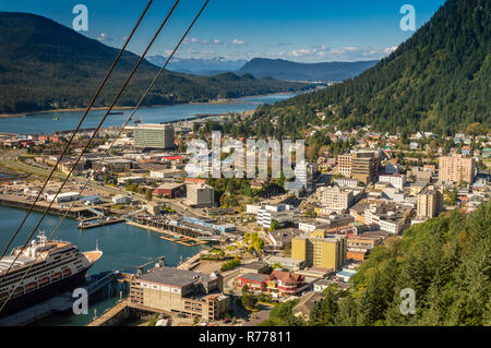 Aerial Northwest view of downtown Juneau the Alaska State capital and cruise ship port from Mount Roberts cable tram. Juneau, Alaska, USA. Stock Photo