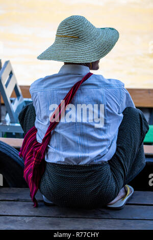 A fisher in the boat at lake Stock Photo