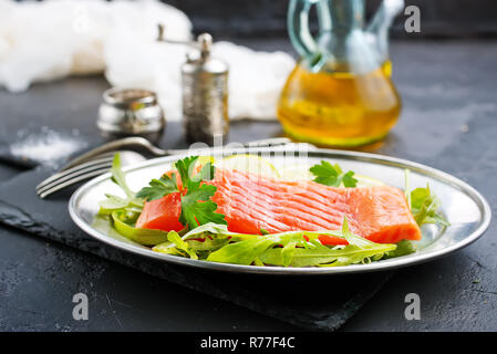 salmon fish with fresh salad on plate Stock Photo