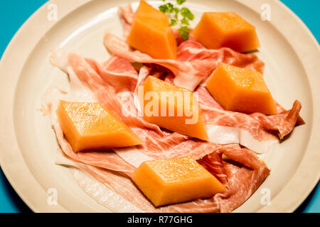 PROSCIUTTO DI PARMA E MELONE Parma ham, rock melon Stock Photo