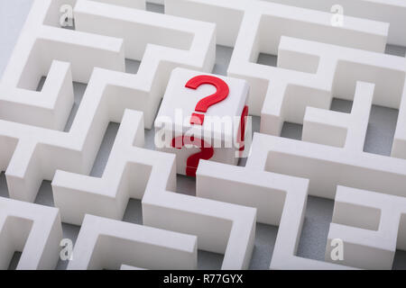 White Cube With Question Mark Sign In The Centre Of Maze Stock Photo