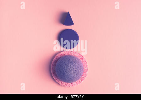 Cosmetic sponge for the face on a pink background. A top view of Flat lay Stock Photo