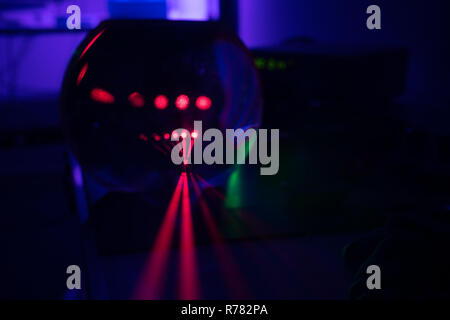 Experiment with red laser in optics lab Stock Photo