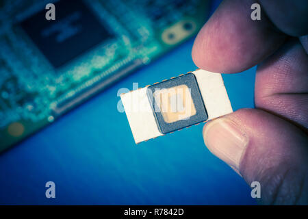 Silicon ceramic chip in the hand Stock Photo