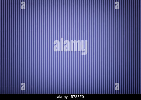 Texture of corrugated dark violet paper with vignette, macro. Striped pattern of purple cardboard background, closeup. Stock Photo