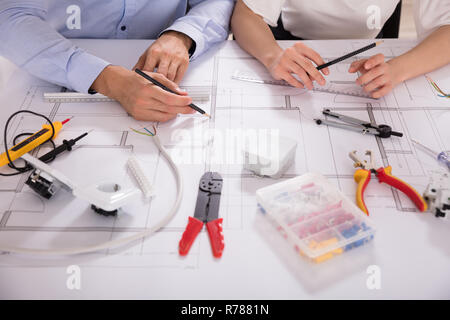 Two Architect Working With Work Tools Stock Photo