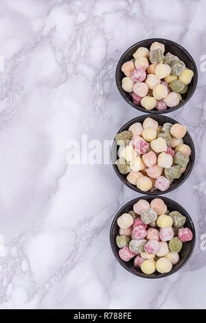 Freshly gnocchi with copy space viewed from above. Fresh homemade potato, spinach and beet dumplings ready for cooking.Vegan Italian food. Stock Photo