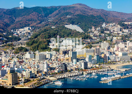 Atami, Shizuoka / Japan - December 1 2018: Aerial cityscape view of Atami beach and city centre, popular onsen leisure resort town in Autumn Stock Photo