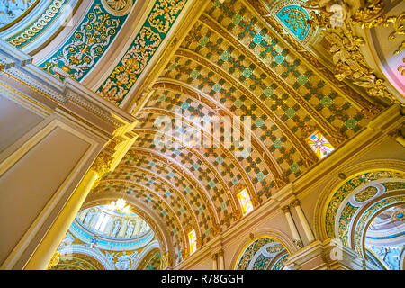 NAXXAR, MALTA - JUNE 14, 2018: The beautiful decorated vault with carved plaster in various geometrical forms with Maltese Crosses, Parish Church of O Stock Photo