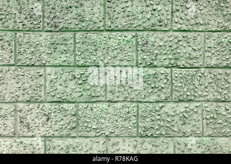 Decorative plaster under a large brick clean Stock Photo