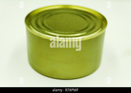 Close up of tin cans arranged on a dark wood background Stock Photo