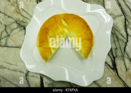 Broccoli egg cheese casserole in baking dish on concrete background. Selective focus, space for text Stock Photo