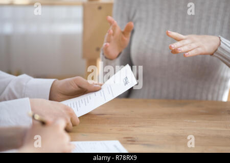 Close up of recruiters read candidate resume at interview Stock Photo