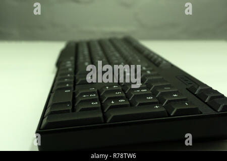 Keyboard from computer side view black on light Stock Photo