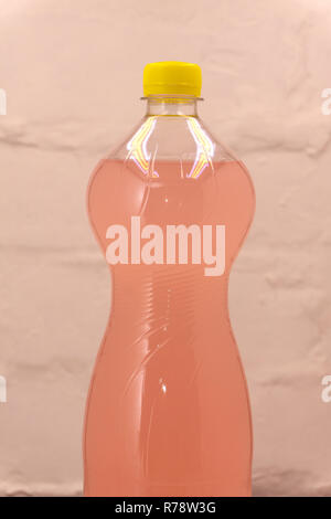 Iced tea, pink lemonade and lemonade summer drinks in bottles with straws and lemon slices isolated on white Stock Photo