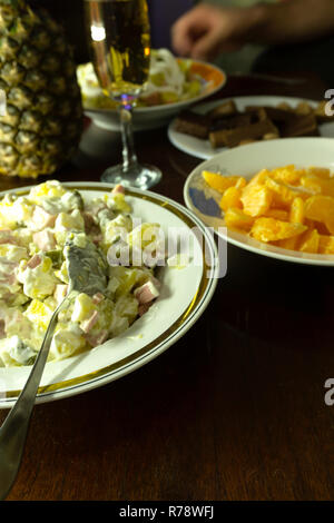 Traditional dishware on Christmas table glowing golden Stock Photo