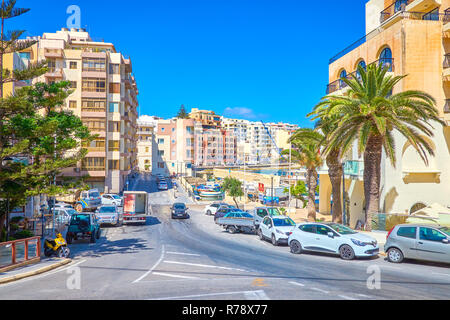 BUGIBBA, MALTA - JUNE 14, 2018: The modern housing of coastline of St Paul's Bay with high hotels and residential edifices, on June 14 in Bugibba. Stock Photo