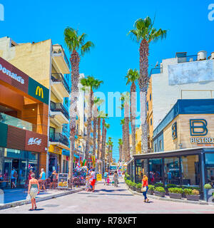 BUGIBBA, MALTA - JUNE 14, 2018: The Pjazza Walkway is the narrow street with the greatest concentration of restaurants and souvenir shops, on June 14  Stock Photo