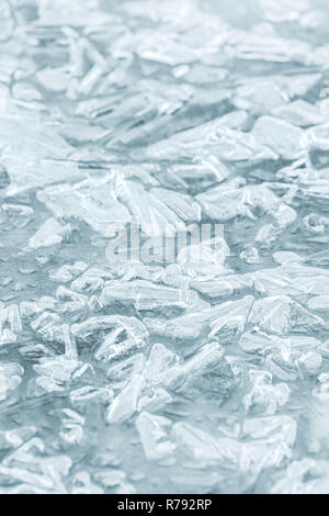 Frozen river surface. Melting rippled ice block with cracks and various patterns Stock Photo