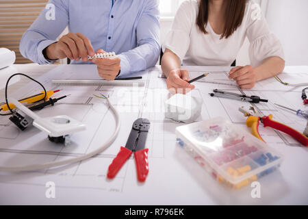 Two Architect Working With Work Tools Stock Photo