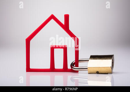 Outline Of Red House Locked With Using Keypad Lock Stock Photo