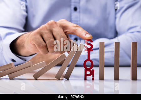 Human Hand Touching Stop Word Stock Photo