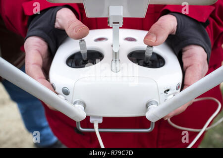 Right control stick for pitch. Pilot maneuver dron on remote controller Stock Photo