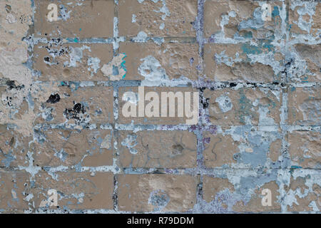 Wall fragment. Futuristic painted brick wall with scratches and cracks Stock Photo
