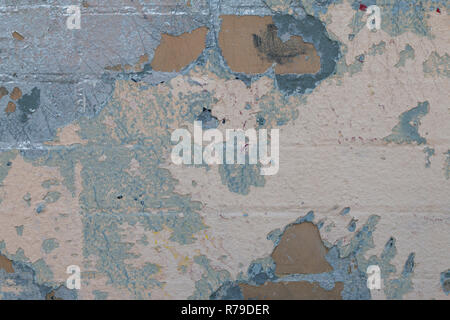 Background of old color vintage stonewall with peeling plaster texture. Abstract background with retro pattern. Modern futuristic painted wall for bac Stock Photo