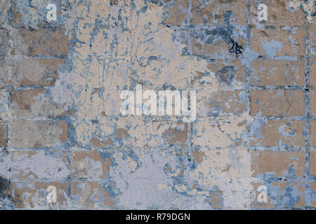 Background of rare colored vintage wall with peeling plaster texture. Abstract design element Stock Photo