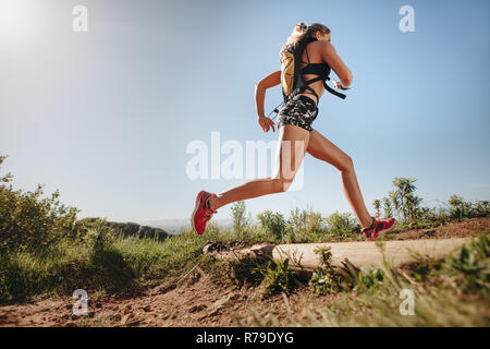 Sports woman running outdoors in the morning. Female athlete in running  attire exercising in morning Stock Photo - Alamy