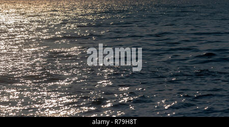 sea wave with golden light from the sun Stock Photo