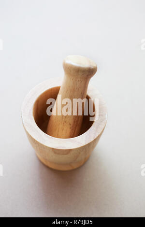 Brown wooden mortar on white background. Stock Photo