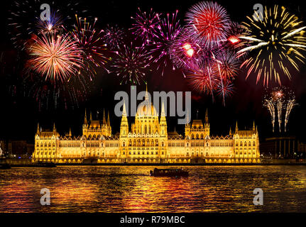 New Year in the city - Budapest Parliament with fireworks Stock Photo