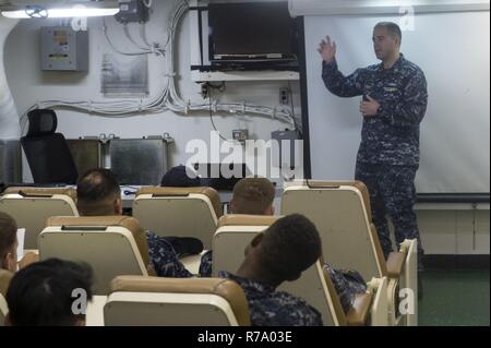 SASEBO, Japan (May 10, 2017) Chief Gunner’s Mate Nick Stemper, from Milwaukie, Wis., assigned to Afloat Training Group (ATG) Western Pacific, instructs members of the Ship’s Self Defense Force (SSDF) on antiterrorism force protection aboard the amphibious assault ship USS Bonhomme Richard (LHD 6). Bonhomme Richard, forward-deployed to Sasebo, Japan, is serving forward to provide a rapid-response capability in the event of a regional contingency or natural disaster. Stock Photo