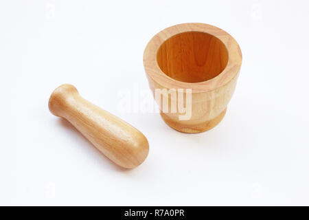 Brown wooden mortar on white. Stock Photo