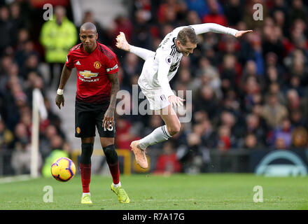 Manchester United's Ashley Young (left) and Fulham's Andre Schurrle battle for the ball during the Premier League match at Old Trafford, Manchester. Stock Photo