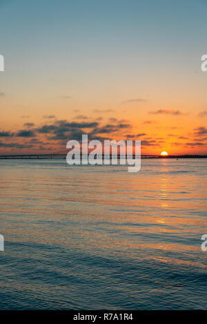 Sunset over the Robert Moses Causeway from Fire Island, New York Stock Photo